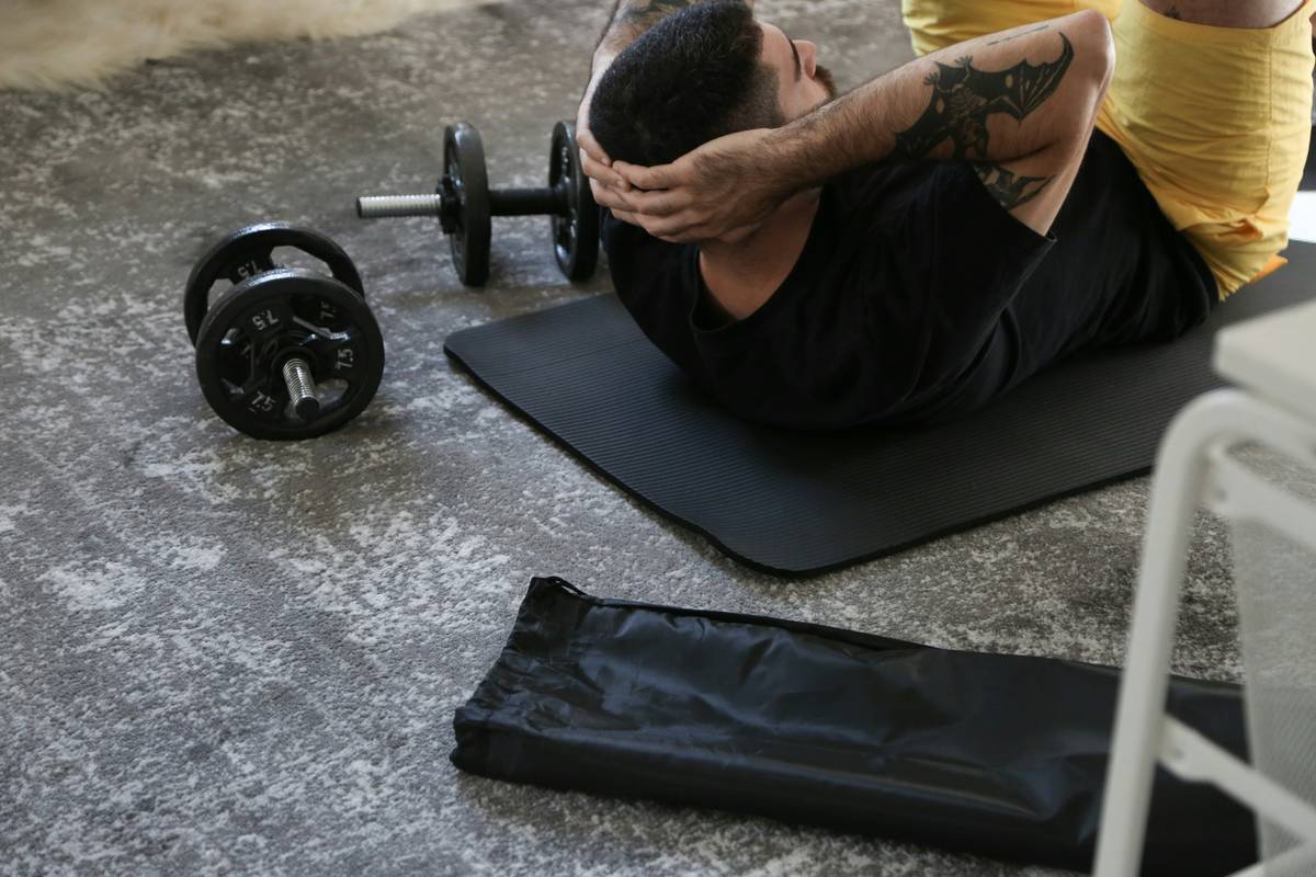 Woman performing kettlebell swing as part of swing slim exercise routine